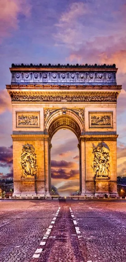 Arc de Triomphe at sunset with vibrant sky.