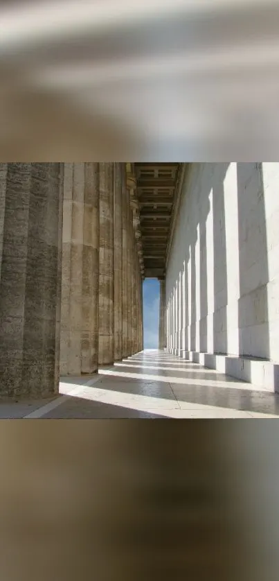 Elegant stone corridor with light and shadow play wallpaper.