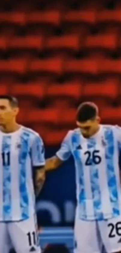 Argentina football players in jerseys with red background.