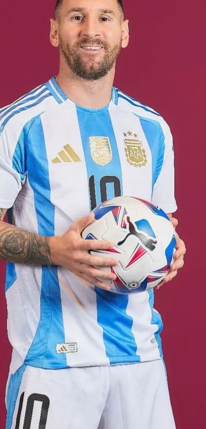 Argentina soccer player in blue and white jersey holding a soccer ball.