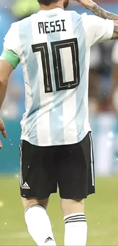 Argentinian footballer in iconic jersey on field.