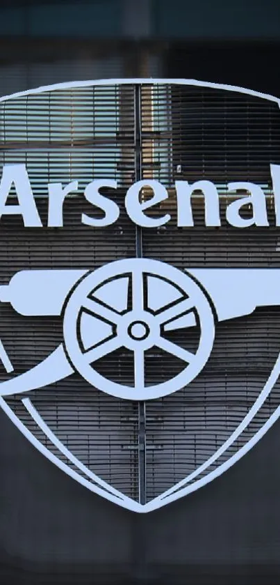 Arsenal logo on a textured background wallpaper.