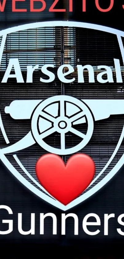 Arsenal logo with red heart and Gunners text on black background.