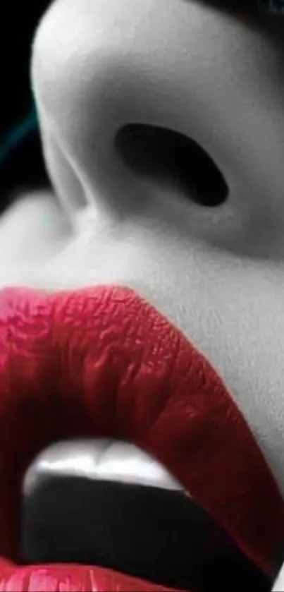 Close-up of vibrant red lips against a monochrome background.