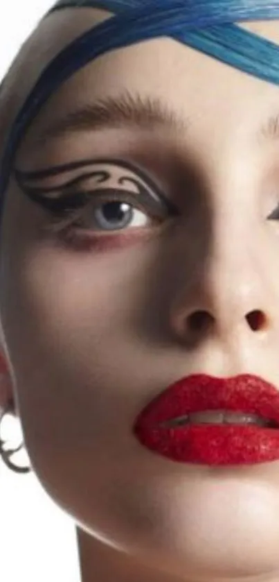 Artistic portrait with bold makeup, featuring blue and red accents.