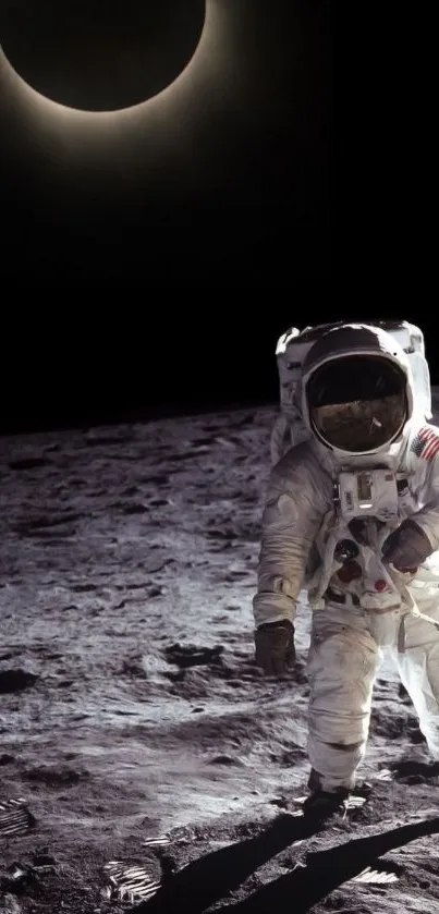 Astronaut walking on moon with solar eclipse in background.