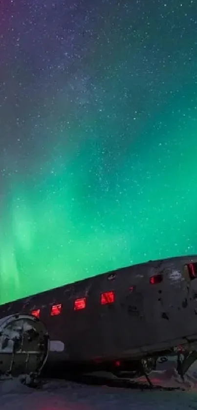 Aurora over abandoned plane under starry night sky.