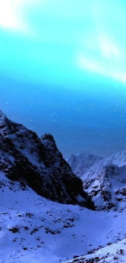 Aurora Borealis illuminating snowy mountains at night, with stars visible in the sky.