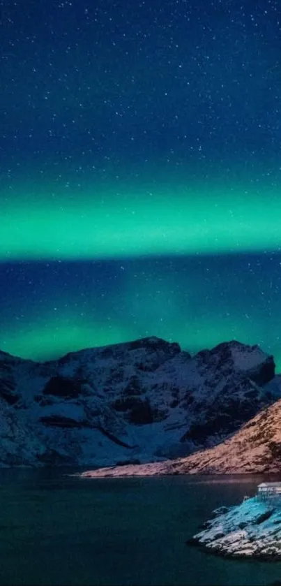 Aurora Borealis over mountains with starry night sky.