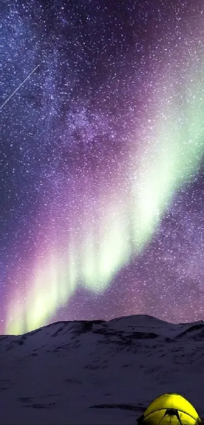 Aurora Borealis over snowy mountains with a campsite under a starry sky.