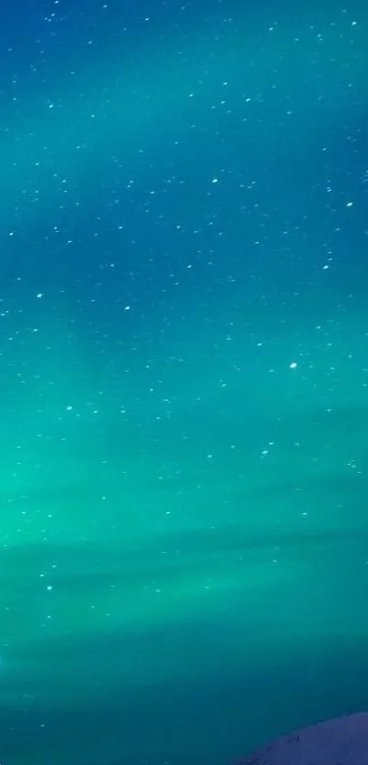 Vibrant aurora borealis illuminating the night sky with stars and teal lights.