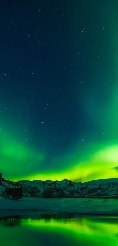 Aurora Borealis over mountains under starry night sky.