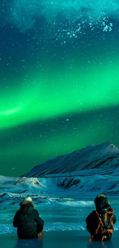 Two people watching Aurora Borealis under a starry night sky.