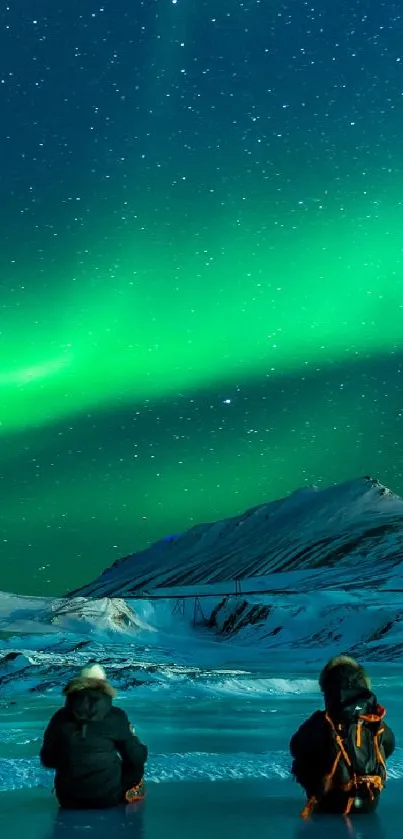 Mobile wallpaper of aurora borealis over snowy mountains at night.