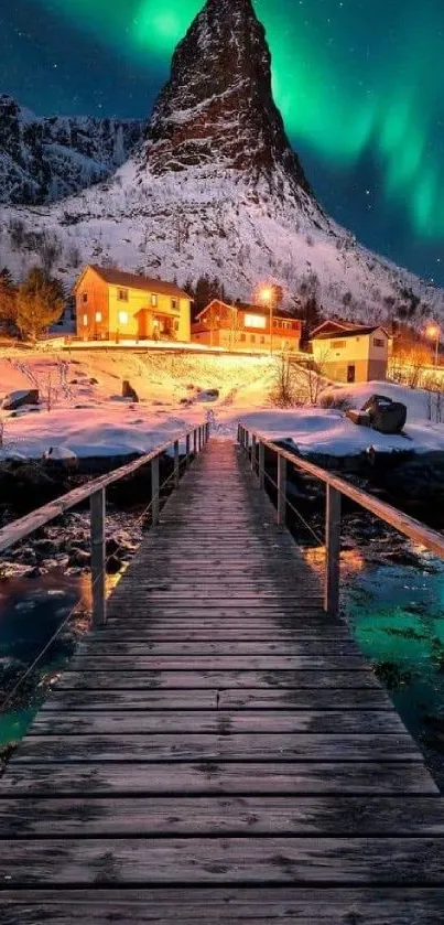 Aurora borealis above snow-covered village at night.