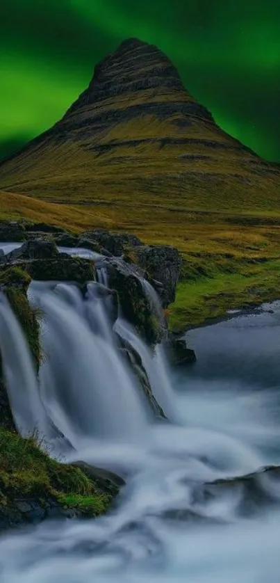 Northern Lights over a waterfall landscape.