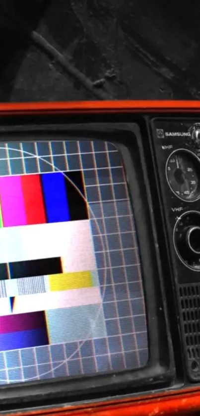 Vintage television displaying a colorful test pattern screen.