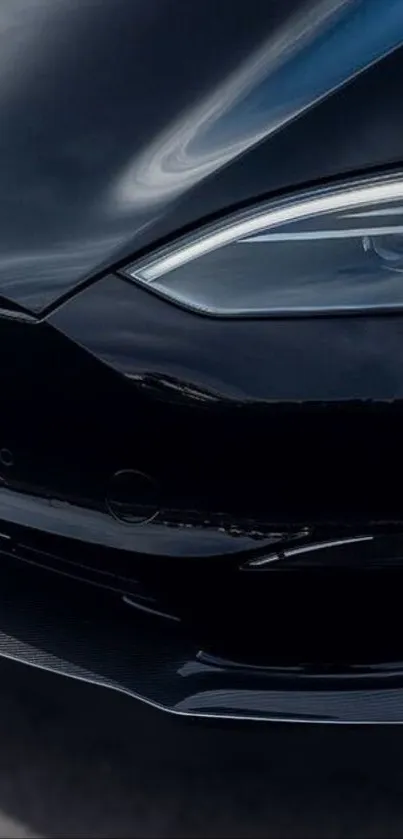 Close-up of a sleek black car with a modern headlight in focus.