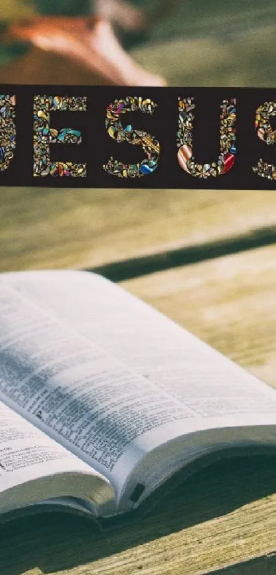 Open Bible with autumn leaves and Jesus text on wooden table.