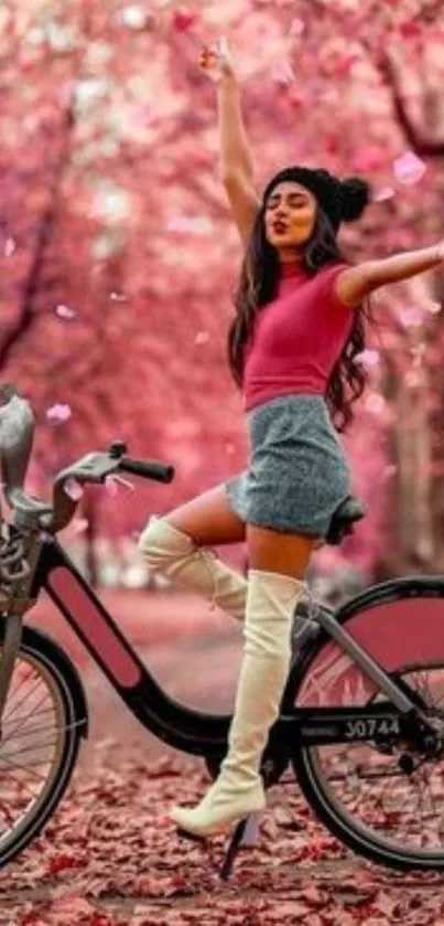 Woman joyfully riding a bicycle amongst pink autumn leaves.