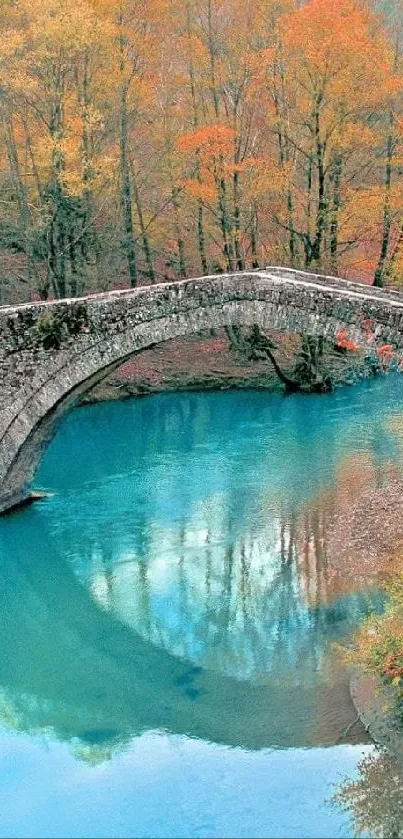 Stone bridge over a blue river in autumn with colorful trees.