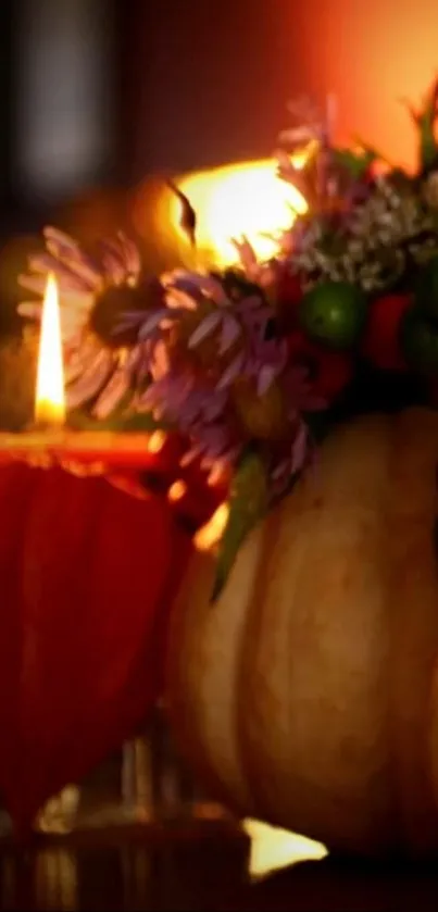 Warm autumn scene with candlelit pumpkin and flowers.