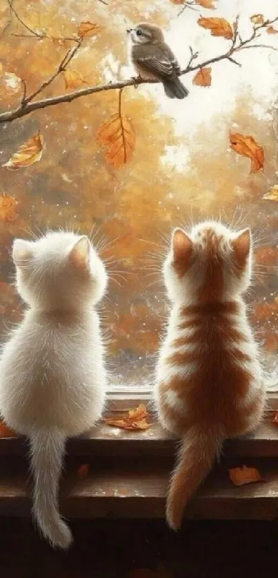 Two kittens watching a bird through a window with autumn leaves.