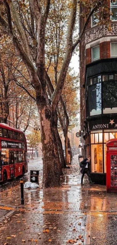 Autumn city street with red bus and phone booth.