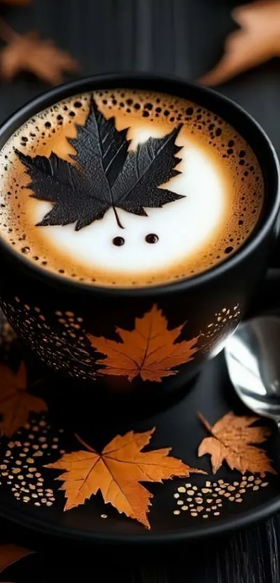 Coffee cup with autumn leaf art on a black saucer.