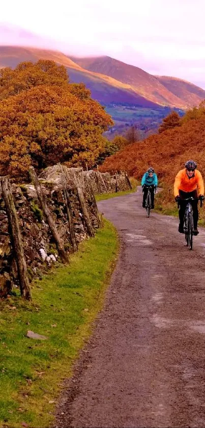 Cyclists ride through an autumn landscape with vibrant foliage and rolling hills.