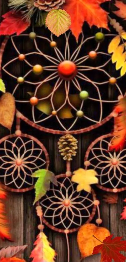 Autumn dreamcatcher with colorful leaves on wooden background.