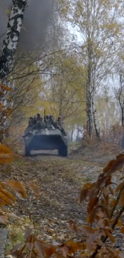 Military vehicle in autumn forest setting.