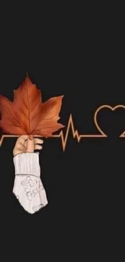 Hand holding a maple leaf on heartbeat line.