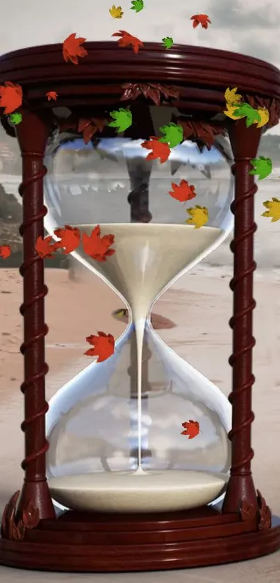 Hourglass on a beach with autumn leaves falling.