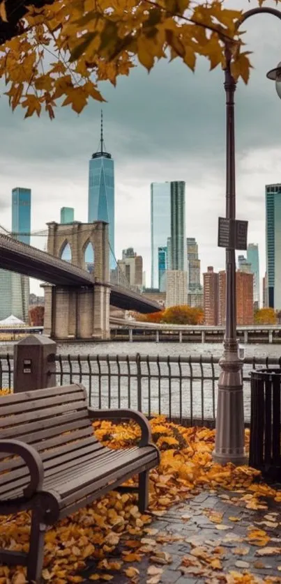 NYC skyline with Brooklyn Bridge and autumn leaves.