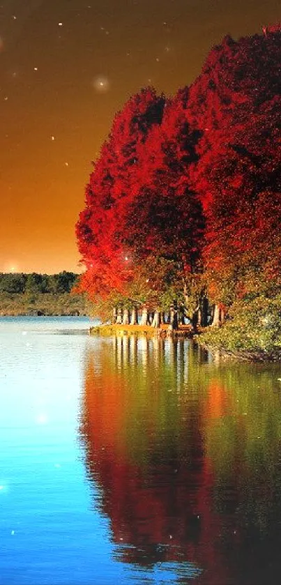 Autumn lake with red trees reflecting on water under an orange sky.