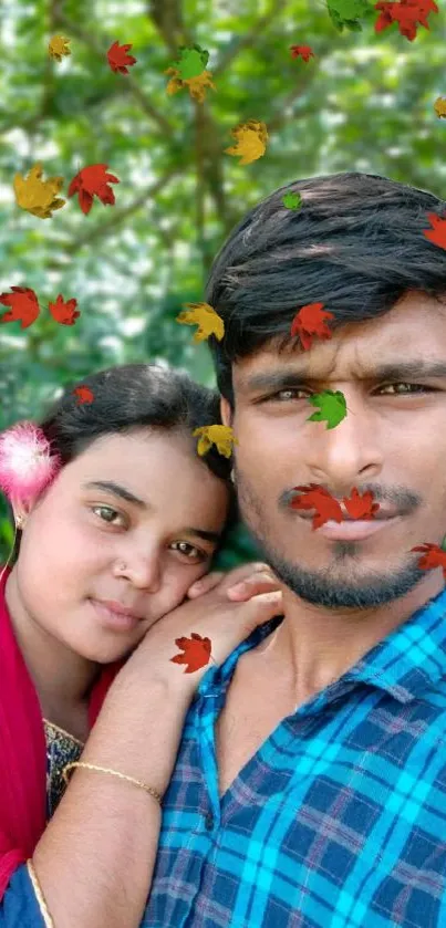 Couple surrounded by falling autumn leaves in nature.