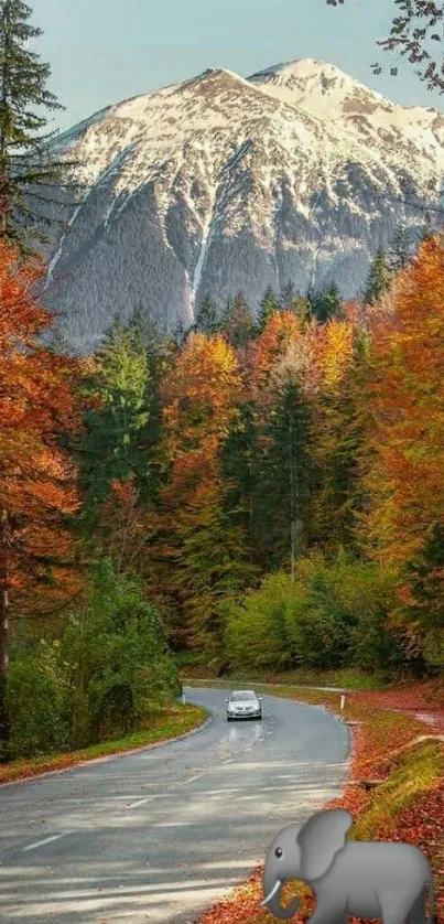 Scenic autumn road with mountains and colorful foliage in vibrant view.