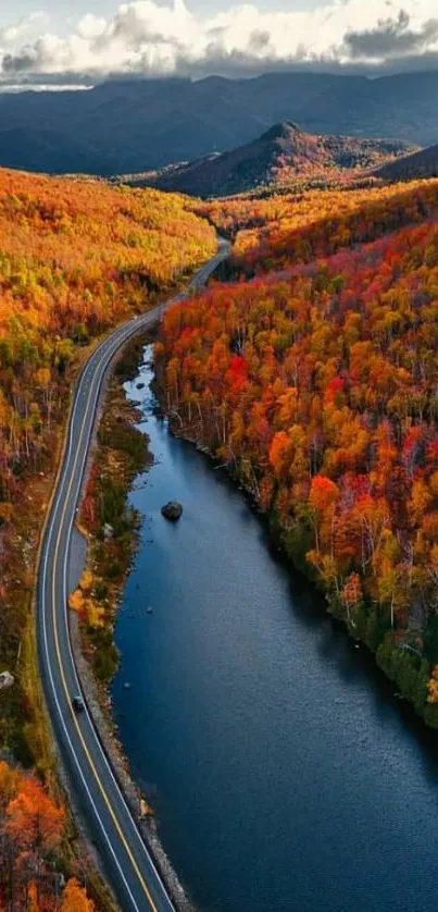 Autumn mountain road with fall foliage and river.