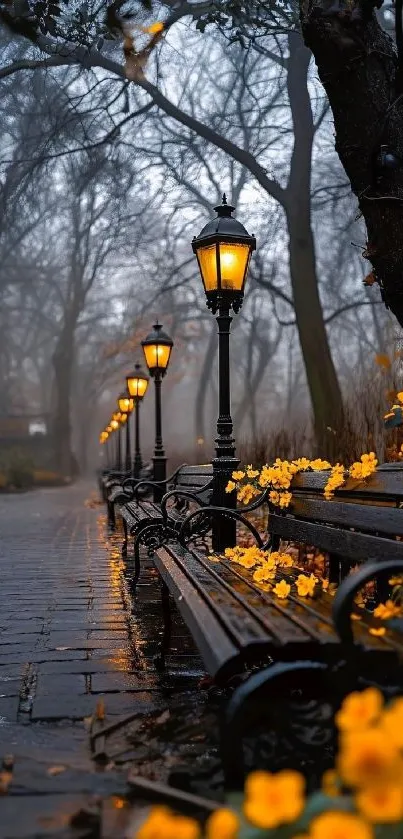 Misty park pathway with glowing lamps and yellow flowers.