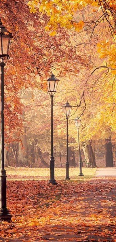 Vintage lamp posts line an autumn pathway with orange leaves in a serene park setting.