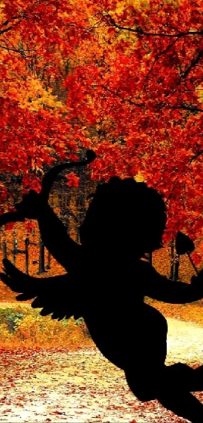 Silhouette of Cupid on a woodland path with autumn leaves.