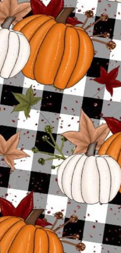 Autumn-themed wallpaper with pumpkins, plaid, and fall leaves.