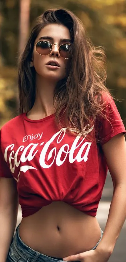 Model in red top on a serene autumn forest road.