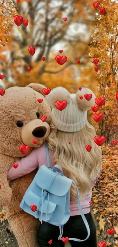 Girl hugging teddy bear amid autumn leaves and red hearts.