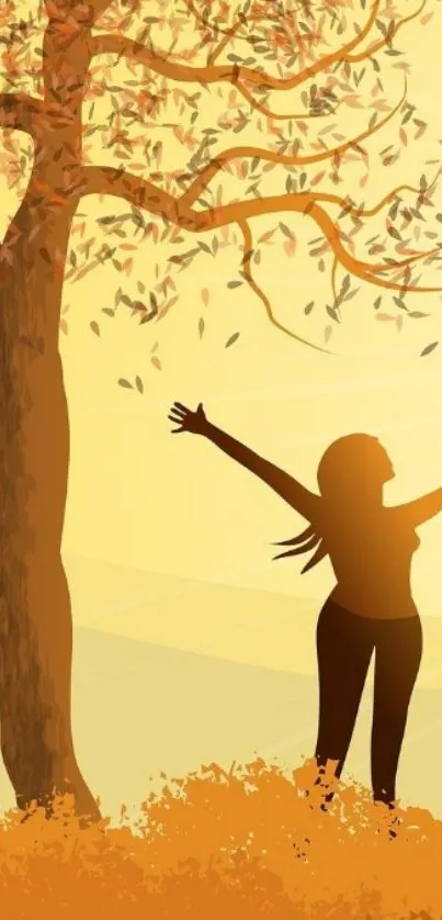 Silhouette of a woman under an autumn tree with falling leaves.