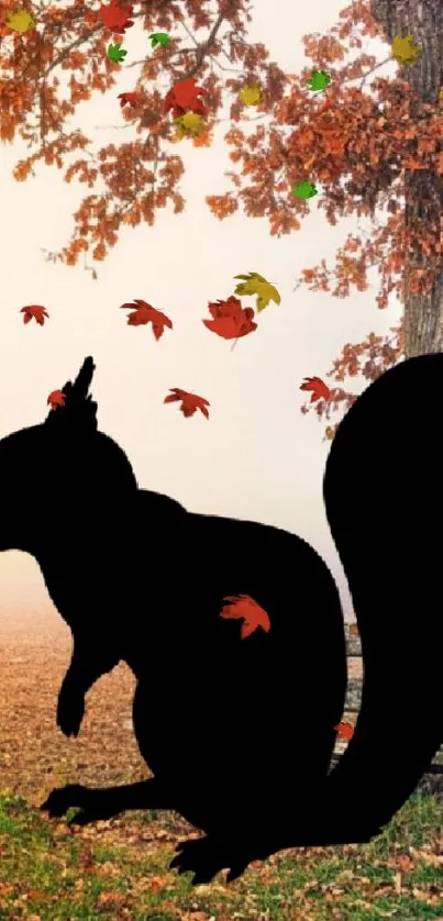 Silhouette of a squirrel under a vibrant tree in autumn landscape.