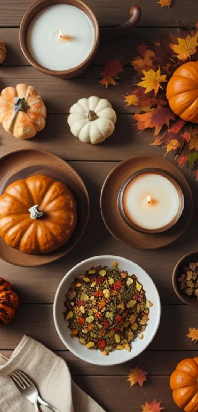 Elegant autumn scene with pumpkins, leaves, and candles on a wooden table.