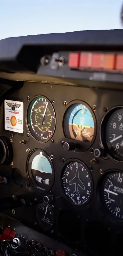 Close-up of aircraft cockpit control panel with dials and gauges.