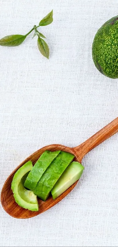 Minimalist wallpaper with avocados and green leaves on a light background.